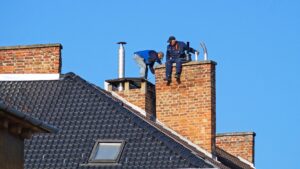 Chimney sweeps on the roof